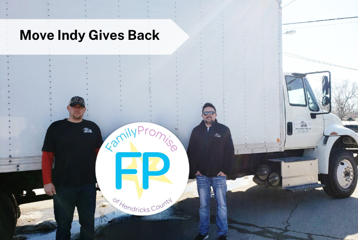 Mark (manager) and Caleb (owner) stand in front of the Move Indy truck during a move for local community partner, Family Promise of Hendricks County.