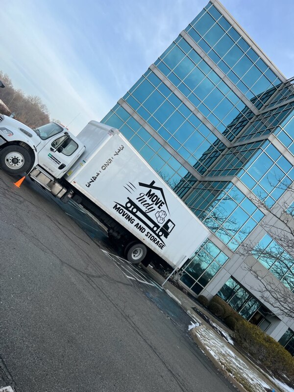 Move Indy, a moving company in Indianapolis, backs their truck into a downtown high-rise to begin their customer's move.